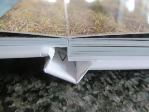 Die flach anliegende leporellobindung beim Echtfotobuch auf Fotopapier im Detail
